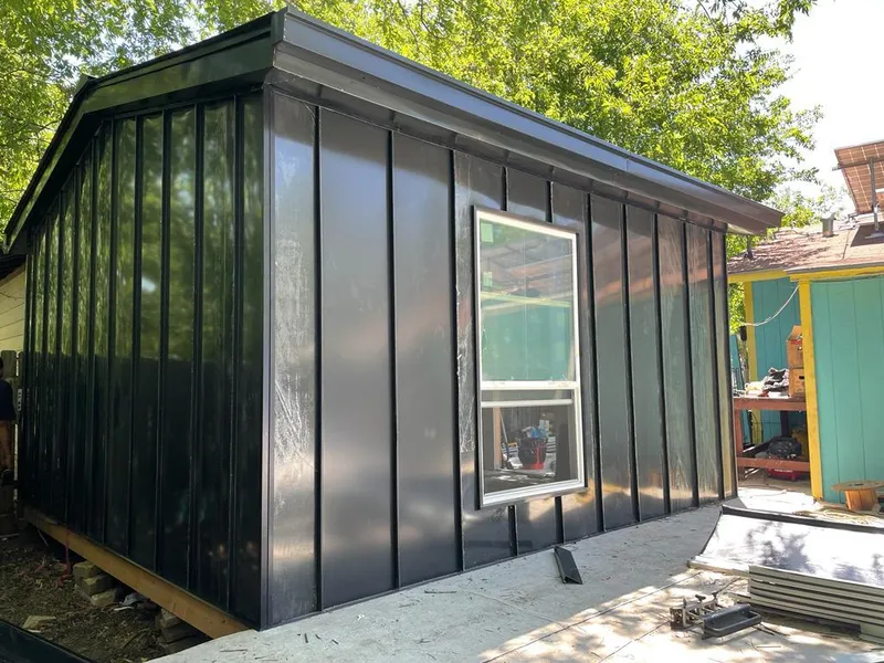 Black standing seam metal wall panels for Roof Inspection in Patterson